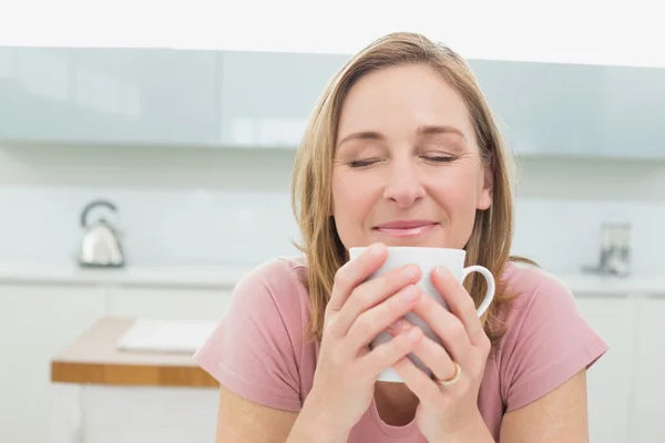 Woman drinking collagen tea for ageing skin