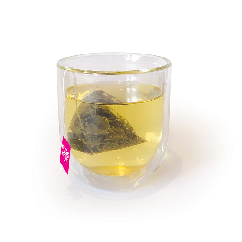 Fusspot Collagen Beauty Tea, a beauty tea with hydrolyzed collagen peptides as a beauty tea to support skin, hair and nails, anti-ageing, reduce wrinkles. Hot pink packaging. Beauty Product. Beauty Tea with collagen peptides, Green Tea... biodegradable compostable enviro-friendly teabags. soilon pyramid teabags in clear teacup lots of antioxidants